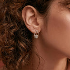 Boucles d'oreilles avec croix dorée et zirconium
