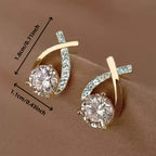 Boucles d'oreilles avec croix dorée et zirconium