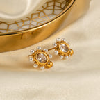Boucles d'oreilles élégantes en or avec perle
