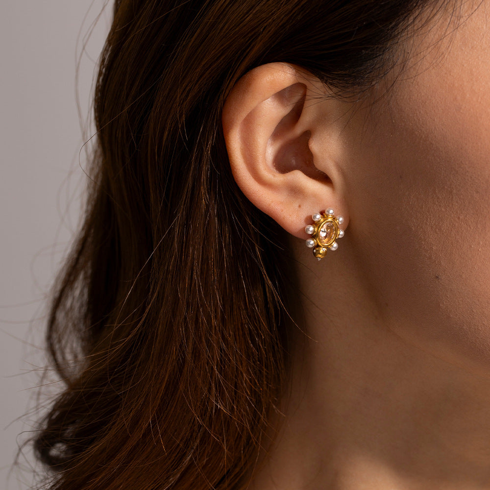 Boucles d'oreilles élégantes en or avec perle